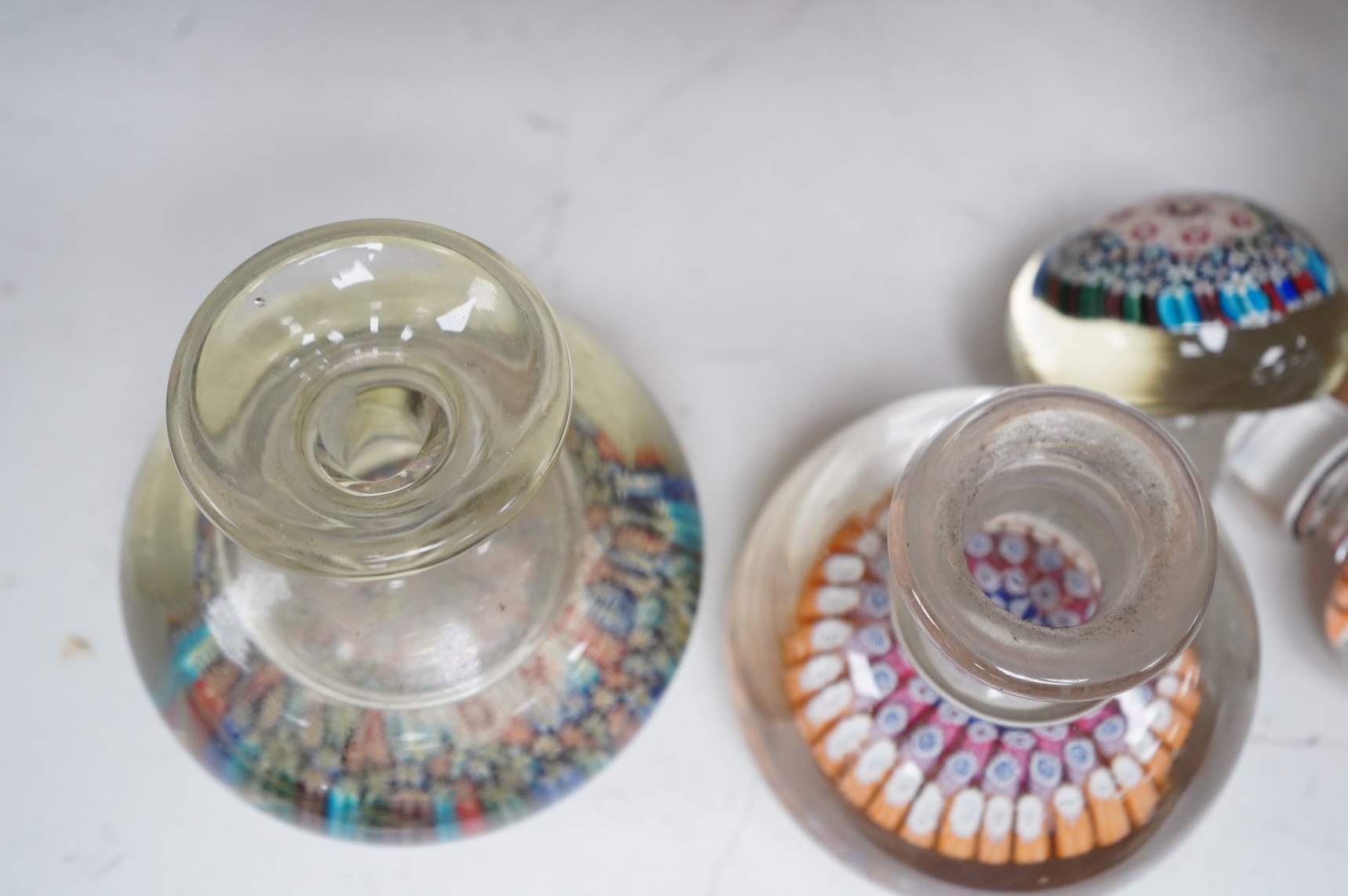 A 19th century millefiori glass inkwell and a similar 20th century inkwell. (2). Largest 16.5cm high